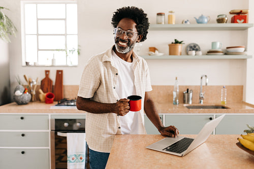 Mature black man enjoying a cup of coando café, Brazilian coffee