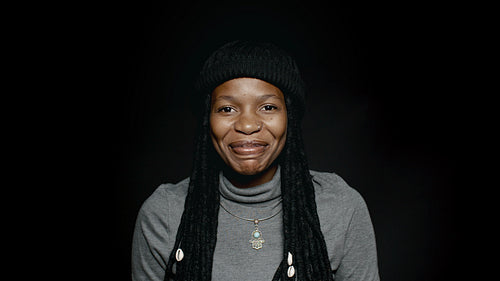 African woman with dreadlocks laughing