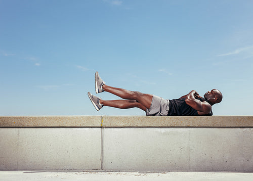 Male athlete making abdominals