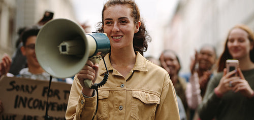 Woman demonstrator protesting with megaphone