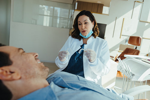 Dentist consultation with male patient in a modern dental clinic