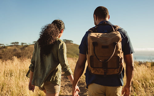 Couple walking on a hill