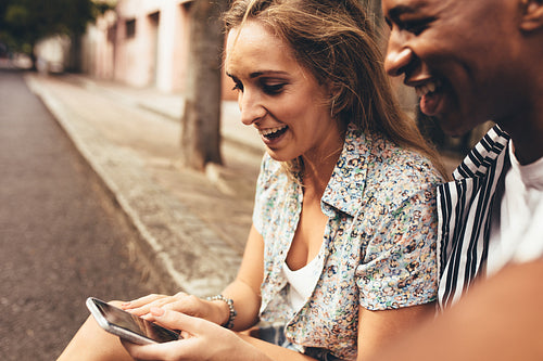 Friends looking pictures on phone