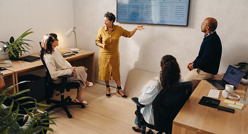 Team brainstorming during a meeting in a modern office space
