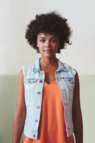 African female model looking confident in smart casuals