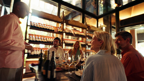 Enjoying a private wine tasting room experience with friends and expert sommelier guidance