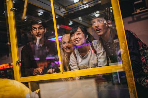 Young friends playing toy grabbing game