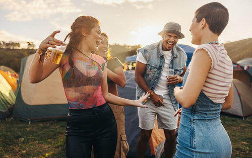Carefree festival day: Dancing, sunset, and joyful drinks