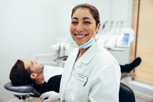 Smiling female dentist in dental hospital