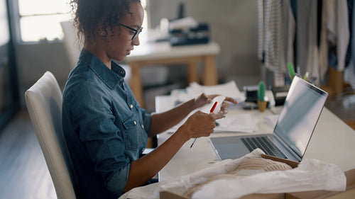 Businesswoman preparing product for delivery to the customer