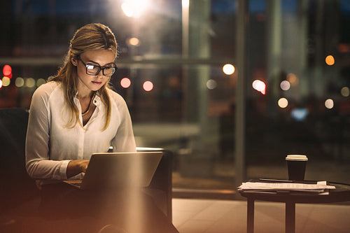 Businesswoman working overtime in the office