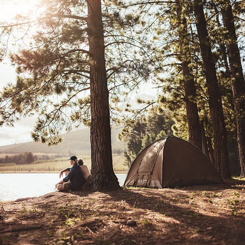 Mature couple camping in the woods