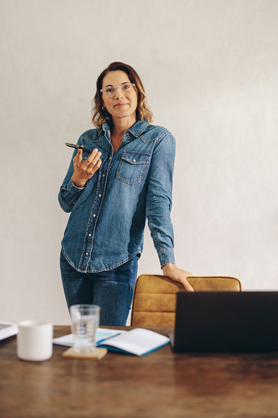 Business woman making a phone call in the office