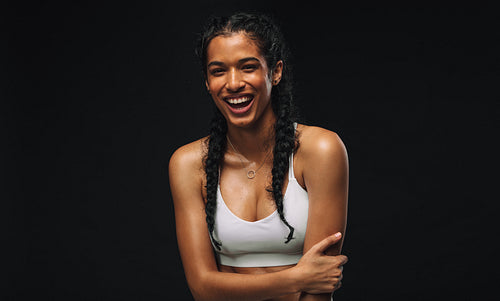 Portrait of fit woman with arms crossed