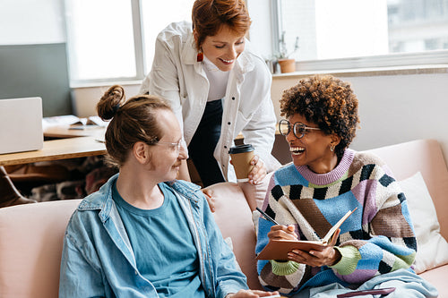 Colleagues collaborating in a modern freelance co-working space