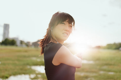 Female runner taking break from training in morning