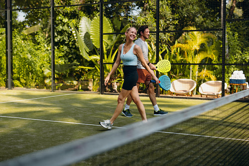 Couple enjoying a game of padel on holiday