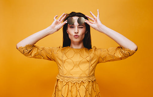 Fashionable female model posing in studio