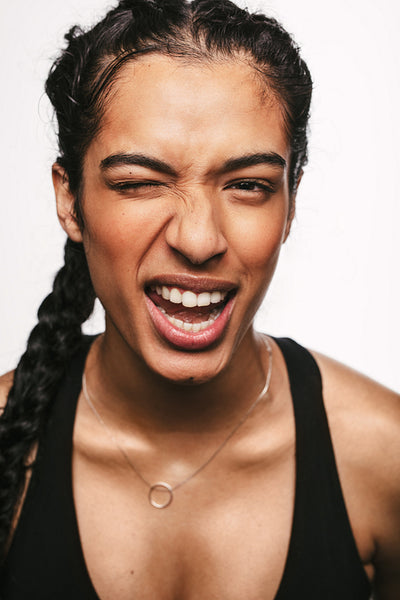 Close up of fit woman winking eye