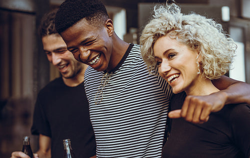 Cheerful young friends hangout out in the city