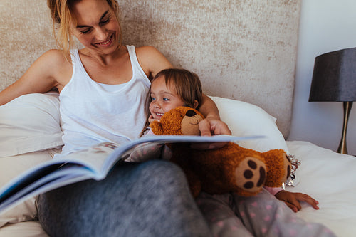 Mother and daughter in bed