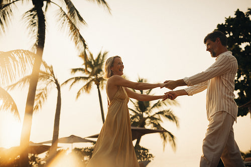 Man and woman having a romantic dance on a tropical vacation