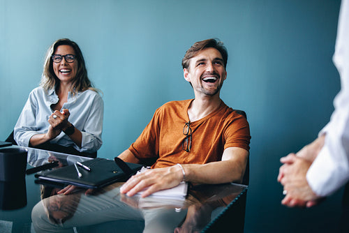 Successful business professionals meeting in a boardroom to discuss a project