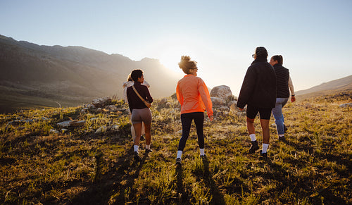 Group hiking in scenic mountain landscape
