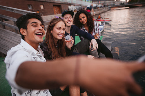 Young people making selfie on a jetty