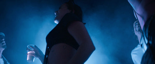 Young woman on the dance floor at a music festival