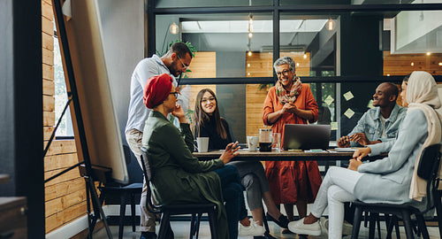 Happy businesspeople having a meeting in a boardroom