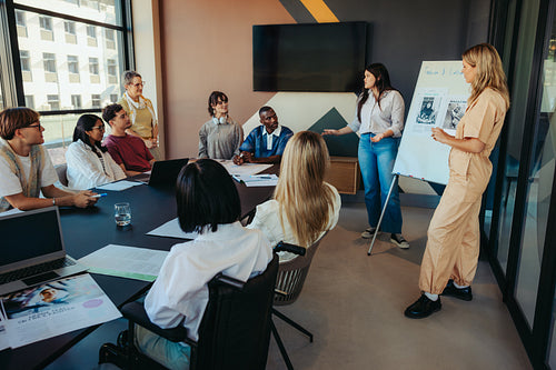 Diverse college students engaged in a city class presentation with teamwork and creativity