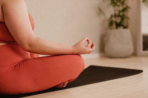 Woman meditating in lotus pose