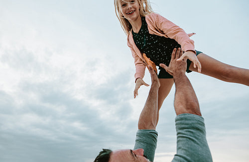Father and daughter playing outdoors