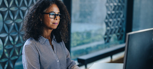 Mature businesswoman working in office