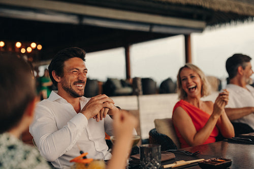 Group of adults enjoying a relaxed gathering at a restaurant