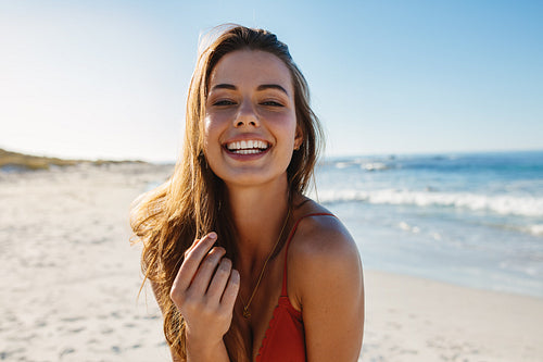 Smiling young woman on the beach
