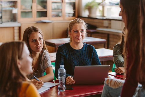 Students chatting in university classroom