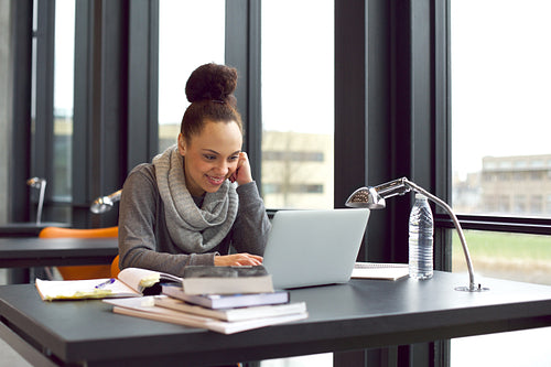 University student studying using laptop