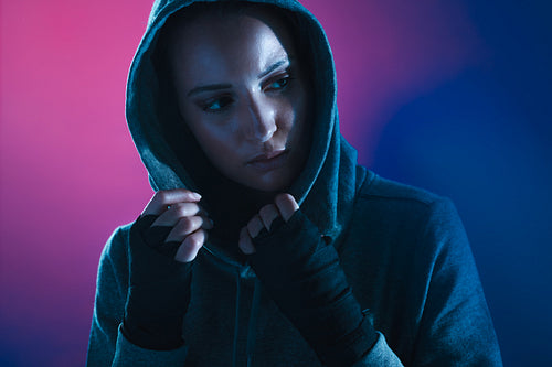 Beautiful fitness girl in sweatshirt