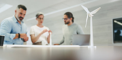Creative designers working on a wind turbine project