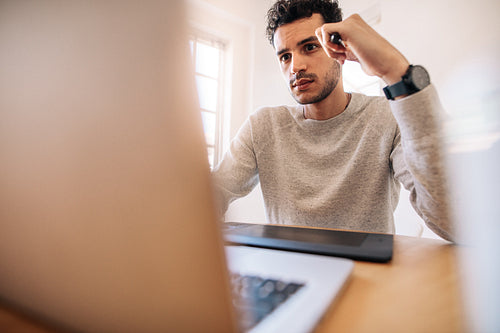 Man looking at laptop computer