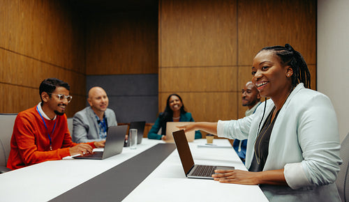 Corporate professionals having a meeting around a modern conference table