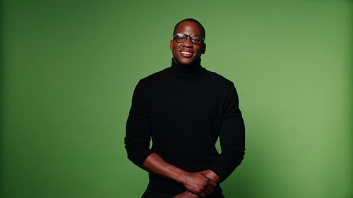 Happy man laughing on green screen background