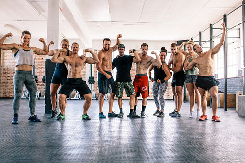 Large group of bodybuilders flexing muscles
