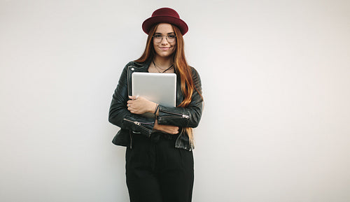 Portrait of a creative businesswoman holding laptop