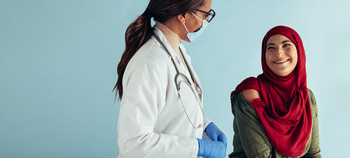 Islamic woman getting vaccination