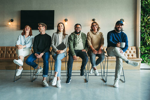 Group of diverse business people smiling happily in an office portrait