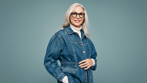 Older woman smiling at the camera confidently