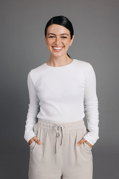 Portrait of a happy young woman smiling at the camera